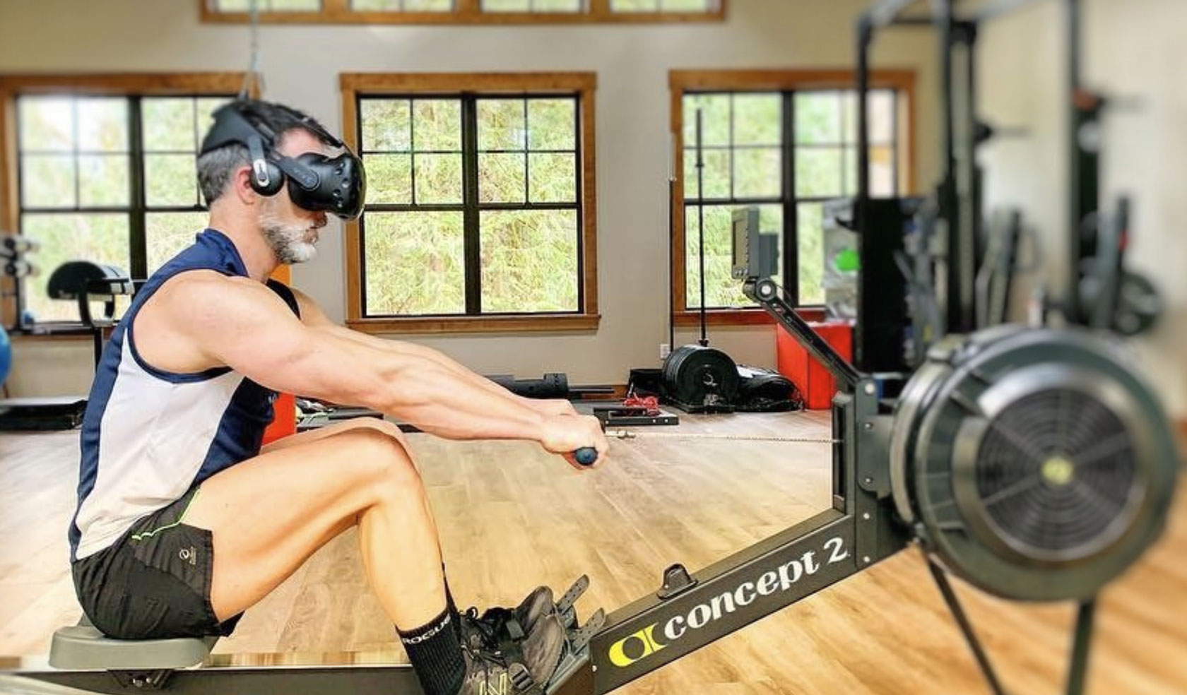 Man using Holofit VR headset with Concept 2 rowing machine